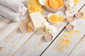 Obraz na płótnie Canvas orange bath salt gray soap orchids and candles