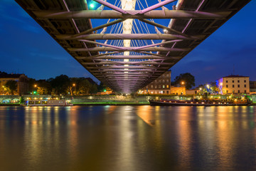 Bernatka footbridge over Vistula river in Krakow at night. Poland. Europe.