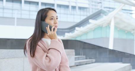 Woman talk to mobile phone at outdoor