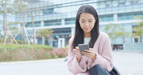 Woman working on mobile phone