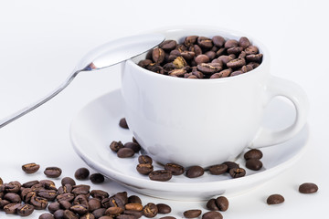 Coffee or espresso cup with coffee beans plain white background