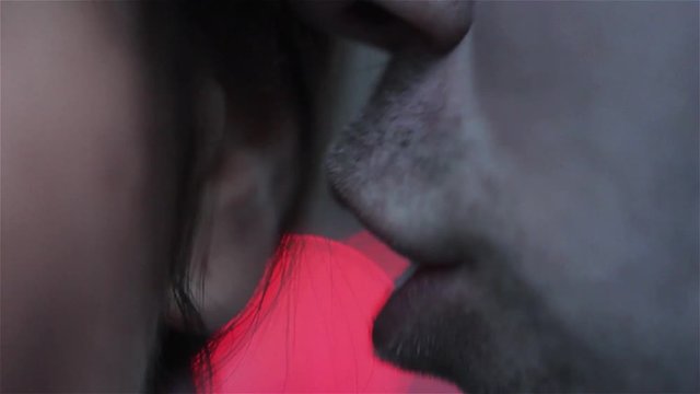 Man Sharing a Secret with a Shocked Woman - Close Up