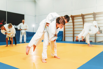 Kid judo, young fighters on training, self-defense