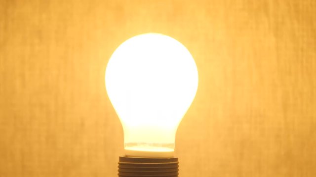 Light bulb with 'warm' light switches on.