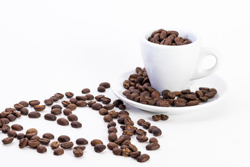 Coffee beans in a coffee or espresso cup next to a heart, Valentine's Day
