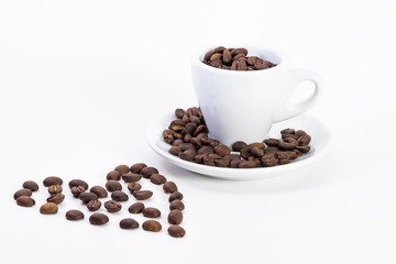 Coffee beans in a coffee or espresso cup next to a heart, Valentine's Day