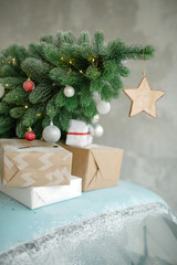 Blue retro car with christmas tree on roof