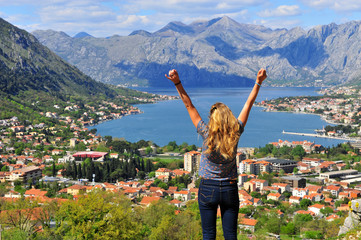 Young woman travelling in bay of Kotor