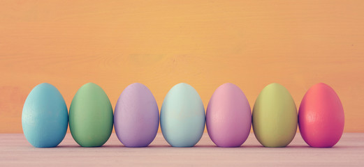 Top view of easter colorful eggs over blue background