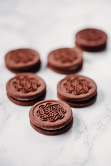 Sandwich cocoa cookie with crema inside