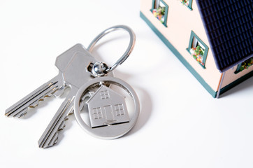 House key on a house shaped pendant.