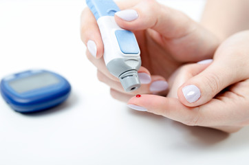 Diabetes doing blood glucose measurement. - obrazy, fototapety, plakaty