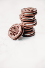 Sandwich cocoa cookie with crema inside