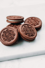 Sandwich cocoa cookie with crema inside