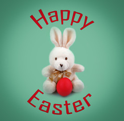 Text Happy Easter and Easter bunny with the red egg isolated on the green background
