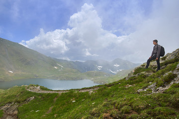 Young man hiking in the mountains