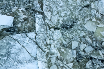 pieces of ice on a frozen river