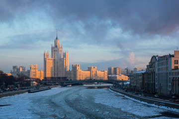Sunset view of the Stalin skyscraper on Kotelnicheskaya embankment of Moscow river. Russia