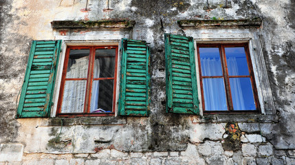 Fototapeta na wymiar Two open windows with green wooden frames
