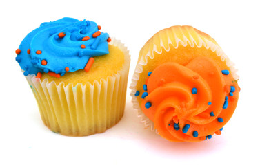 Two colorful cupcakes isolated over white background
