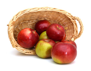 Red apples in basket on white