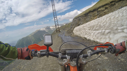 Enduro journey with dirt bike high in the mountains