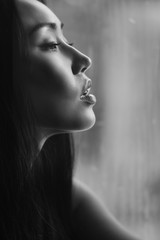 Black and white portrait of a girl on a gray background