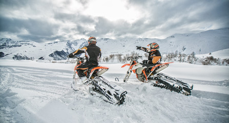 Enduro Snowbike Snowmobile journey with dirt bike high in the mountains - obrazy, fototapety, plakaty