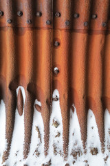 Rusty pipe in snow