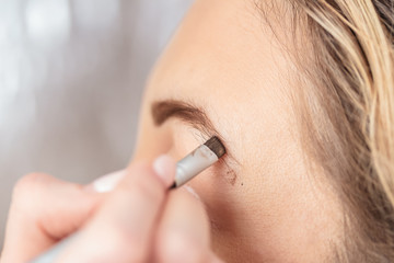 make-up and modeling of eyebrows, close-up