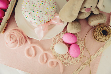 Easter cake and pink eggs on a  wooden table