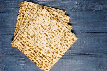 traditional Jewish kosher matzo for Easter pesah on a wooden table. Jewish Easter food. Spring.