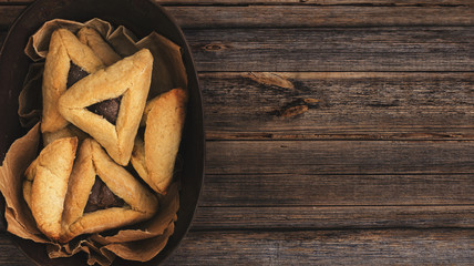 Jewish Hamantaschen homemade biscuits or cookies with chocolate. Top view or overhead composition with copy space