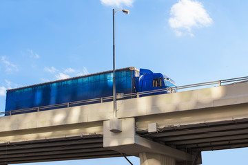 truck delivers freight on bridge