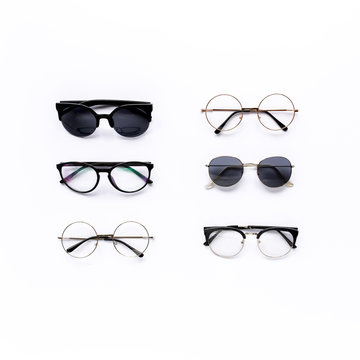 Female sunglasses on white background. Flat lay, top view. 