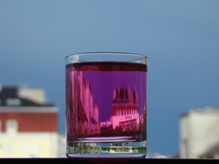 Pink liquor in a glass double vision