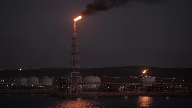 Gas flare of petrochemical refinery in  twilight