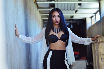 Model with long hair, bright make-up and accessories