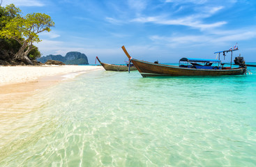 Fototapeta na wymiar Amazing view of beautiful beach with traditional thailand longtale boat. Location: Bamboo island, Krabi province, Thailand, Andaman Sea. Artistic picture. Beauty world.