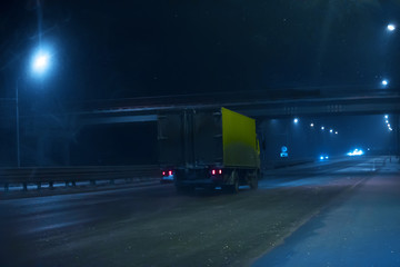 truck is moving along the winter road
