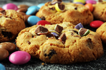 Chocolate cookies with colorful candies. Chocolate chip smarties cookies.