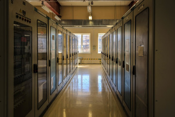 Switchgear room with cabinets with network hardware