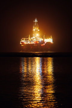 offshore oil platform at night