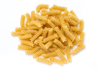 Uncooked fusilli pasta isolated white background.