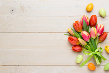 Spring easter tulips in bucket on white vintage background.
