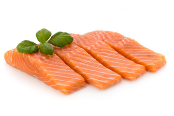 Fresh salmon fillet with basil on the white background.
