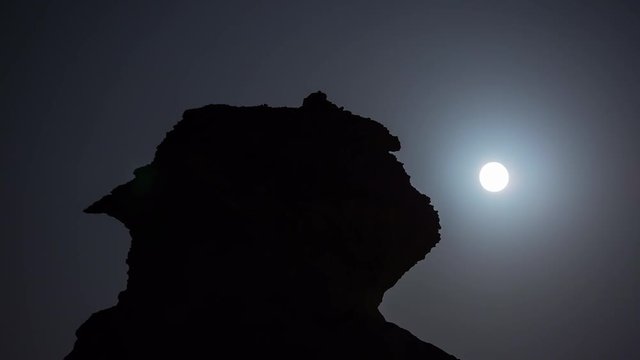 Qatar desert night moon waterless heat sand supermoon behind the stone