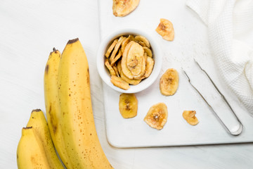 dried banana on white background.Homemade Dehydrated Banana Chips
