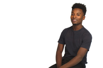 young man relaxing sitting pensive positive attitude studio style