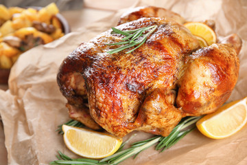Delicious whole roasted chicken served on table
